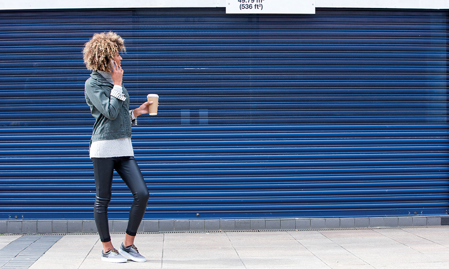 Woman outside a Shop Roller Shutter